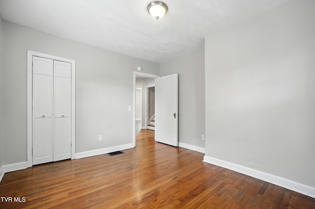 1340 Wateree St, Kingsport, TN 37660 - unfurnished bedroom with wood finished floors and a closet