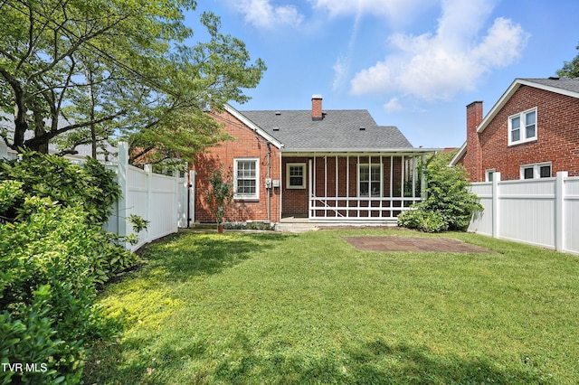 1340 Wateree St, Kingsport, TN 37660 - back of house featuring brick siding, a fenced backyard, a chimney, and roof with shingles