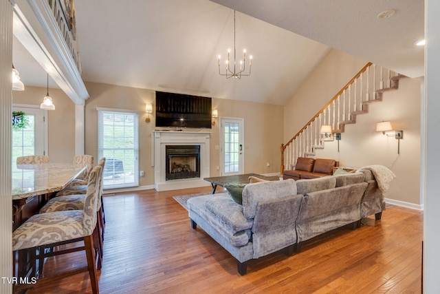 2424 Rivermont Dr, Kingsport, TN 37660 - living area with hardwood / wood-style flooring, stairs, plenty of natural light, and high vaulted ceiling