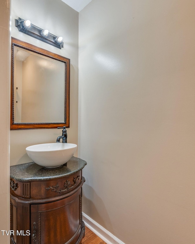 2424 Rivermont Dr, Kingsport, TN 37660 - bathroom with vanity and wood finished floors