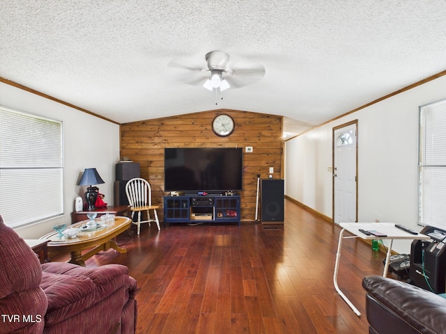 109 Wampler St, Kingsport, TN 37665 - living room with wood walls, a ceiling fan, wood-type flooring, vaulted ceiling, and ornamental molding