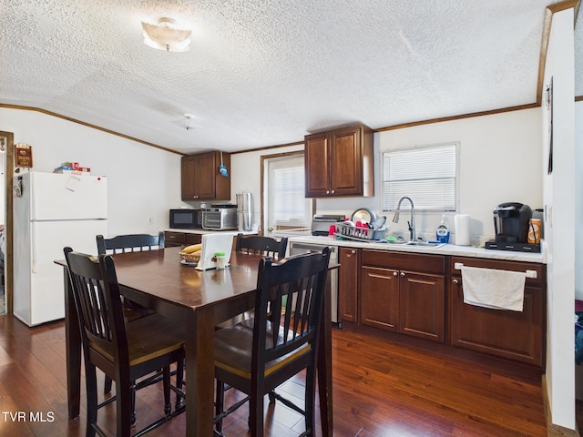 109 Wampler St, Kingsport, TN 37665 - dining area with crown molding, dark wood-style flooring, and a textured ceiling