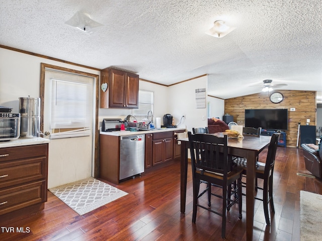 109 Wampler St, Kingsport, TN 37665 - kitchen with dishwasher, wood walls, light countertops, a ceiling fan, and dark wood finished floors