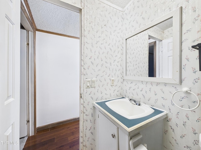 109 Wampler St, Kingsport, TN 37665 - bathroom featuring wallpapered walls, hardwood / wood-style flooring, vanity, and ornamental molding