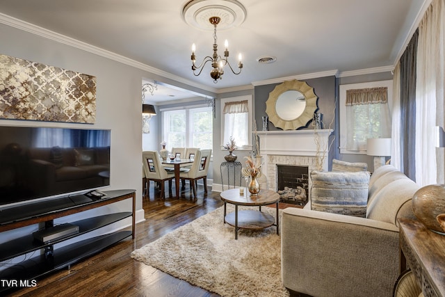 3277 Ashley St, Kingsport, TN 37664 - living area with a chandelier, wood finished floors, crown molding, and a fireplace