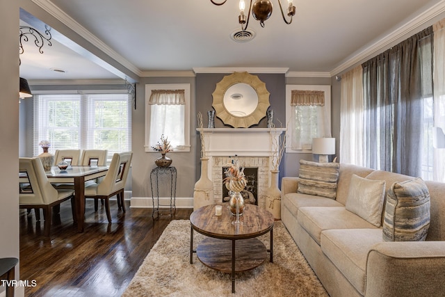 3277 Ashley St, Kingsport, TN 37664 - living room featuring wood finished floors, a fireplace, crown molding, and a chandelier