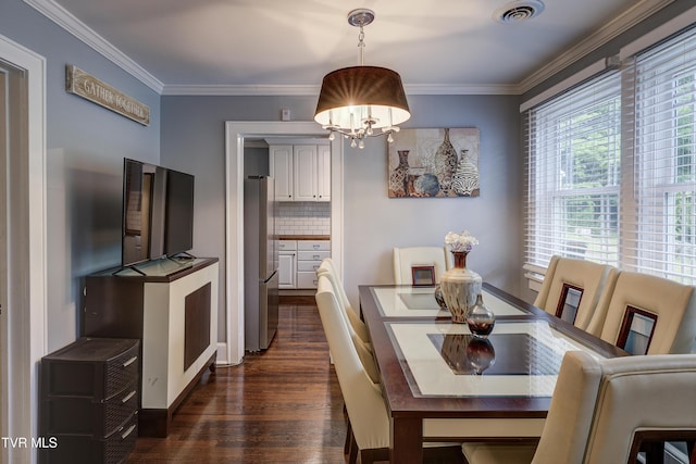 3277 Ashley St, Kingsport, TN 37664 - dining room with dark wood-type flooring, a chandelier, and ornamental molding