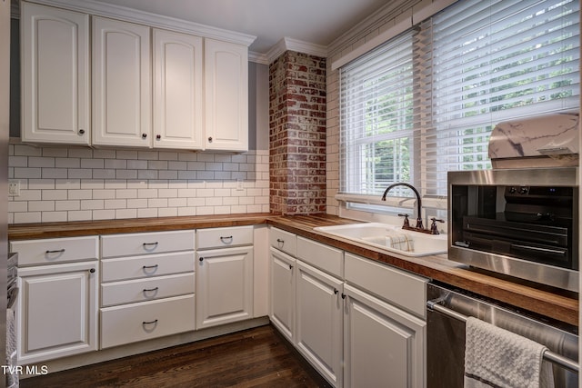 3277 Ashley St, Kingsport, TN 37664 - kitchen featuring wood counters, ornamental molding, tasteful backsplash, dark wood-style flooring, and white cabinets