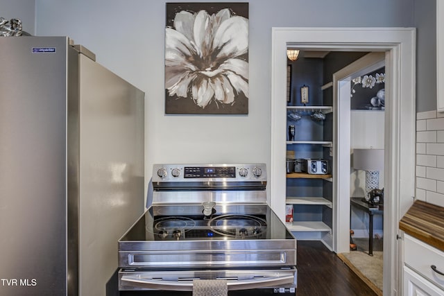 3277 Ashley St, Kingsport, TN 37664 - kitchen featuring stainless steel appliances, dark wood-style floors, and white cabinetry