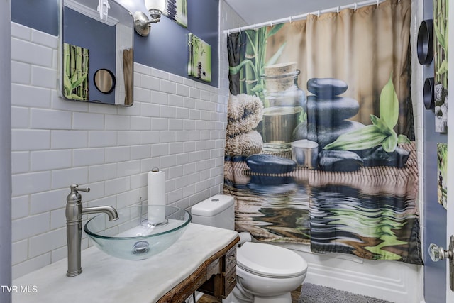 3277 Ashley St, Kingsport, TN 37664 - bathroom featuring tile walls, a shower with shower curtain, vanity, and tasteful backsplash