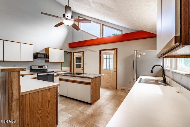 2480-2482 Elk Way, Newport, TN 37821 - kitchen with stainless steel appliances, white cabinetry, a ceiling fan, a center island, and high vaulted ceiling