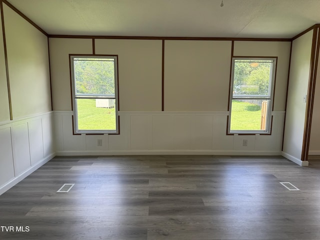 118 Clover, Jonesborough, TN 37659 - empty room with a decorative wall, plenty of natural light, wood finished floors, and a wainscoted wall
