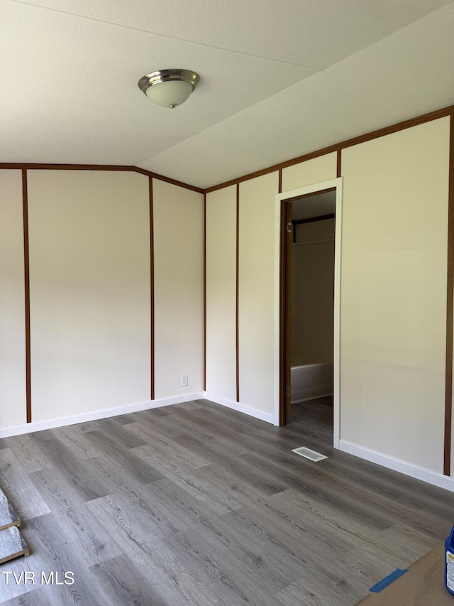 118 Clover, Jonesborough, TN 37659 - unfurnished bedroom featuring dark wood finished floors, lofted ceiling, and a closet