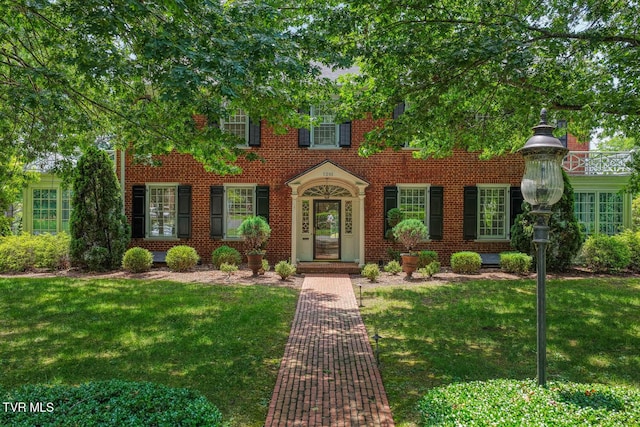 1261 Watauga St, Kingsport, TN 37660 - view of front of property featuring a front yard and brick siding