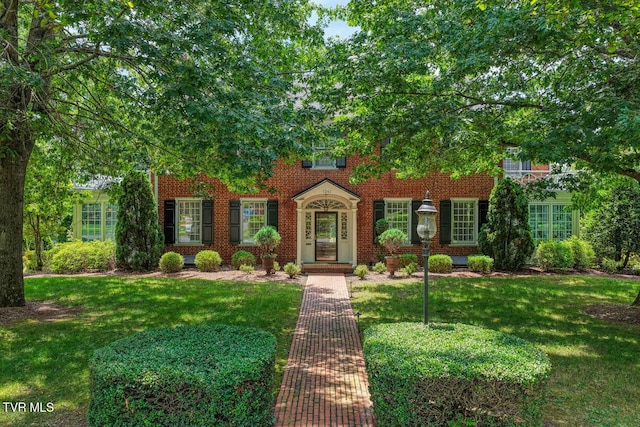 1261 Watauga St, Kingsport, TN 37660 - view of front facade with a front yard and brick siding