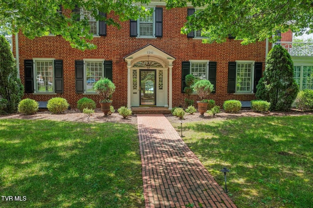 1261 Watauga St, Kingsport, TN 37660 - view of front of property featuring a front yard and brick siding