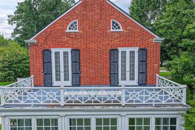 1261 Watauga St, Kingsport, TN 37660 - view of side of home with a balcony, french doors, and brick siding
