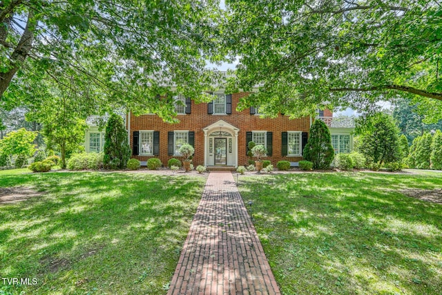 1261 Watauga St, Kingsport, TN 37660 - colonial inspired home featuring a front yard and brick siding