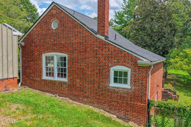 1261 Watauga St, Kingsport, TN 37660 - view of side of property with a chimney and brick siding