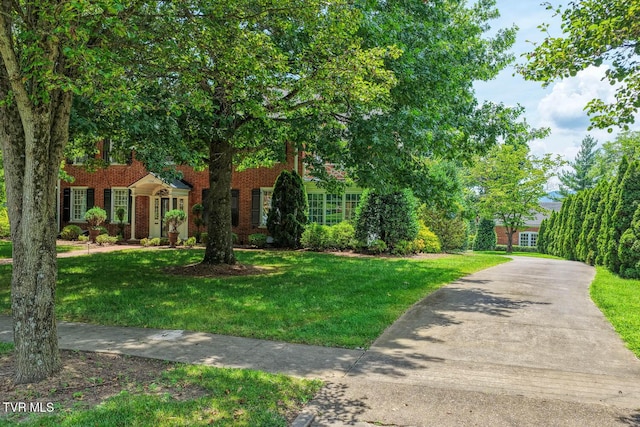 1261 Watauga St, Kingsport, TN 37660 - view of front facade featuring a front lawn and brick siding
