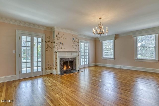 1261 Watauga St, Kingsport, TN 37660 - unfurnished living room featuring a chandelier, light wood-style floors, a fireplace, and ornamental molding