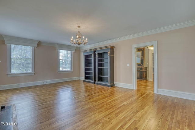 1261 Watauga St, Kingsport, TN 37660 - unfurnished room featuring light wood finished floors, a chandelier, and crown molding