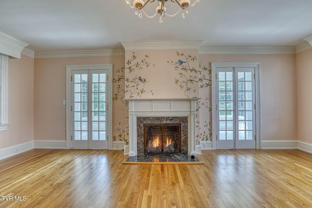1261 Watauga St, Kingsport, TN 37660 - unfurnished living room featuring plenty of natural light, wood finished floors, a premium fireplace, and crown molding