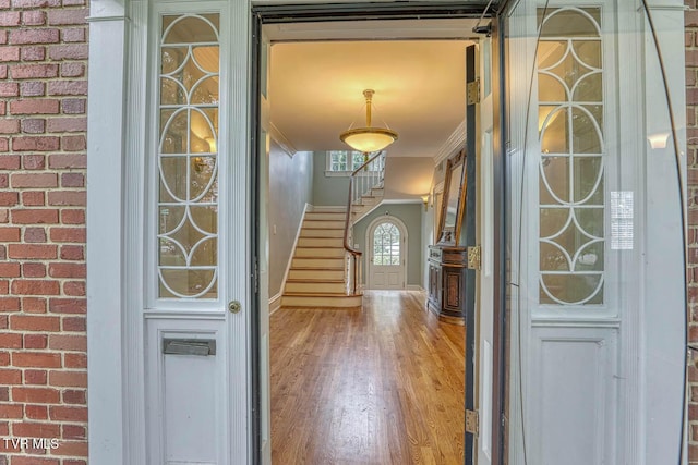1261 Watauga St, Kingsport, TN 37660 - foyer entrance with stairway, wood finished floors, and crown molding