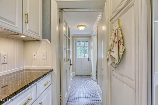 1261 Watauga St, Kingsport, TN 37660 - doorway featuring ornamental molding, light flooring, and a decorative wall