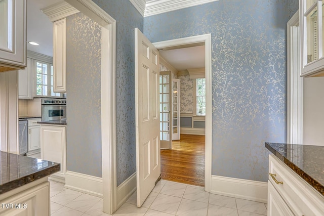 1261 Watauga St, Kingsport, TN 37660 - corridor with light marble finish floors, ornamental molding, and wallpapered walls