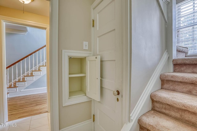 1261 Watauga St, Kingsport, TN 37660 - stairway featuring tile patterned flooring and built in shelves