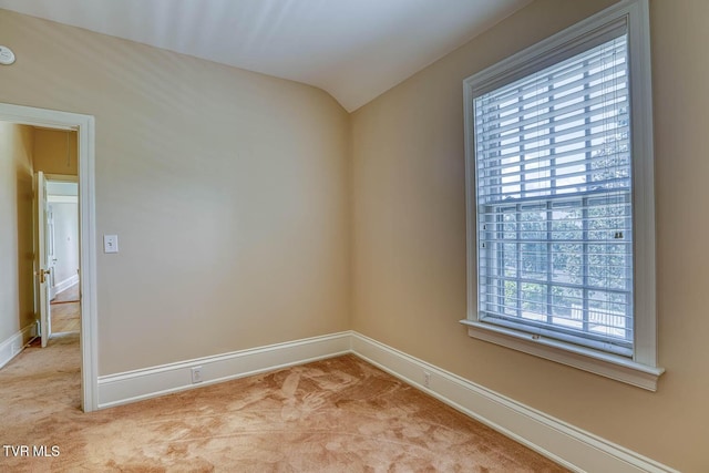 1261 Watauga St, Kingsport, TN 37660 - empty room featuring lofted ceiling, light carpet, and a smoke detector