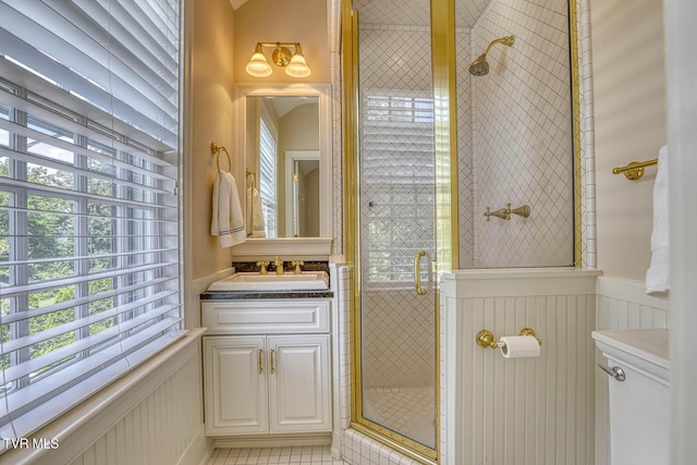 1261 Watauga St, Kingsport, TN 37660 - full bathroom featuring a stall shower, wainscoting, vanity, and tile patterned flooring