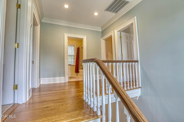 1261 Watauga St, Kingsport, TN 37660 - hallway with an upstairs landing, wood finished floors, ornamental molding, and recessed lighting
