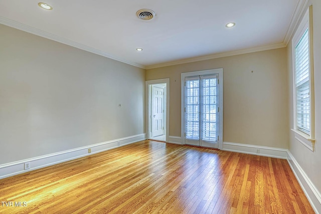 1261 Watauga St, Kingsport, TN 37660 - spare room featuring healthy amount of natural light, light wood-style flooring, crown molding, and recessed lighting