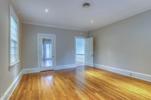 1261 Watauga St, Kingsport, TN 37660 - unfurnished room featuring light wood-style floors, plenty of natural light, and ornamental molding