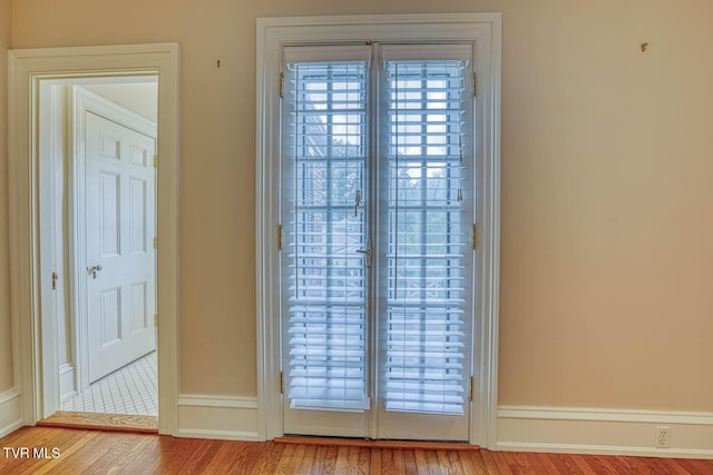 1261 Watauga St, Kingsport, TN 37660 - doorway to outside with wood finished floors and baseboards