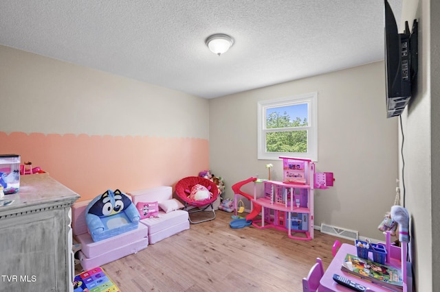 3020 Ridgemont Cir, Kingsport, TN 37663 - game room featuring wood finished floors and a textured ceiling