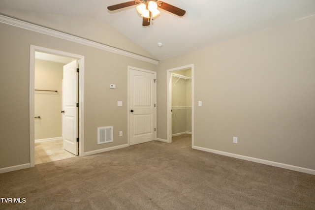 1900 Knob Creek Rd Unit 404, Johnson City, TN 37604 - unfurnished bedroom featuring vaulted ceiling, carpet flooring, a walk in closet, a closet, and ensuite bathroom