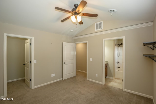 1900 Knob Creek Rd Unit 404, Johnson City, TN 37604 - unfurnished bedroom featuring lofted ceiling, a spacious closet, light colored carpet, ensuite bath, and a ceiling fan