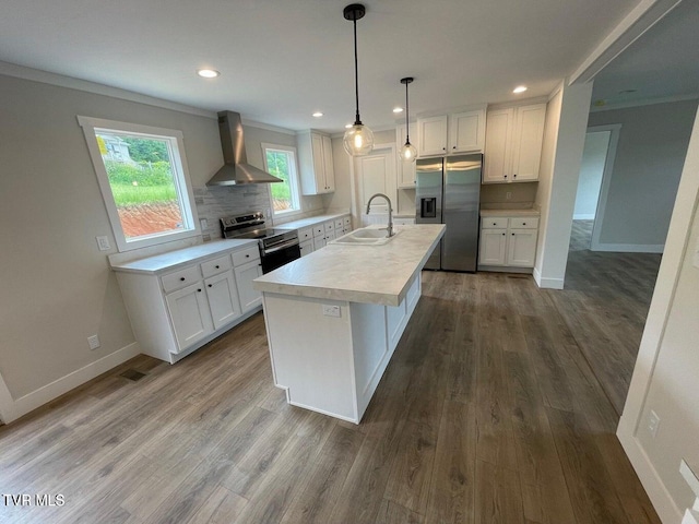 1819 Siesta Dr, Newport, TN 37821 - kitchen with wall chimney range hood, appliances with stainless steel finishes, white cabinets, light countertops, and backsplash
