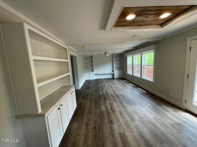 1819 Siesta Dr, Newport, TN 37821 - unfurnished room featuring dark wood-type flooring, built in shelves, and a ceiling fan