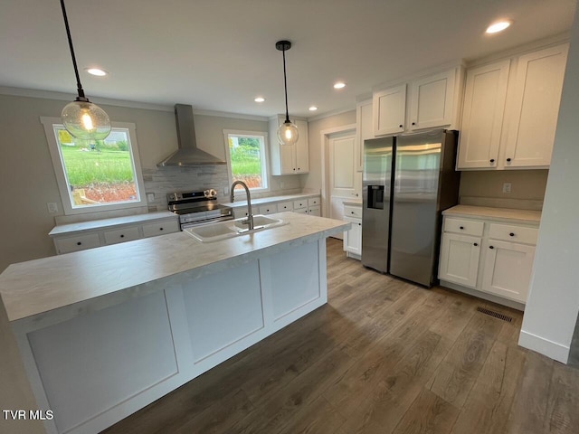 1819 Siesta Dr, Newport, TN 37821 - kitchen featuring wall chimney range hood, appliances with stainless steel finishes, light countertops, white cabinetry, and crown molding