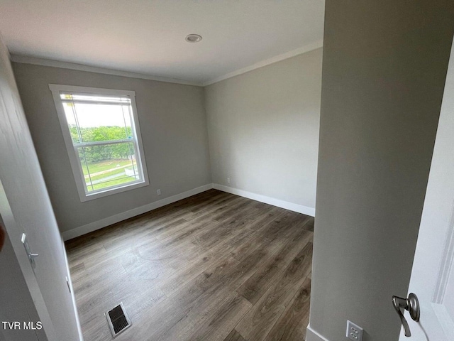 1819 Siesta Dr, Newport, TN 37821 - spare room with crown molding and dark wood-style flooring