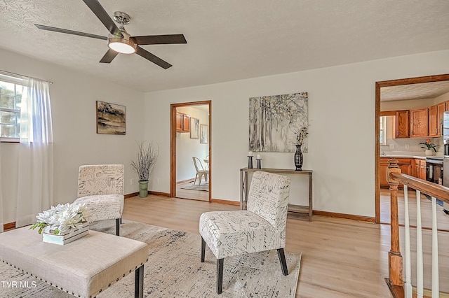 4970 Old Stage Rd, Chuckey, TN 37641 - sitting room with light wood-style floors, a ceiling fan, and a textured ceiling