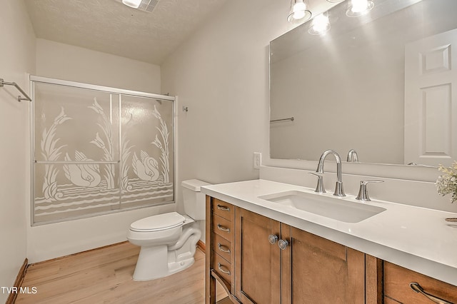 4970 Old Stage Rd, Chuckey, TN 37641 - full bath with vanity, wood finished floors, a textured ceiling, and shower / bath combination