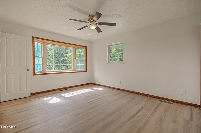 4970 Old Stage Rd, Chuckey, TN 37641 - spare room featuring light wood-style floors, a ceiling fan, and a textured ceiling