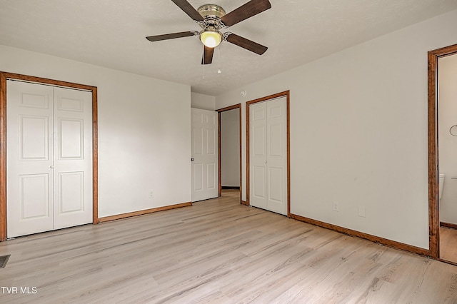4970 Old Stage Rd, Chuckey, TN 37641 - unfurnished bedroom with light wood finished floors, a ceiling fan, and multiple closets