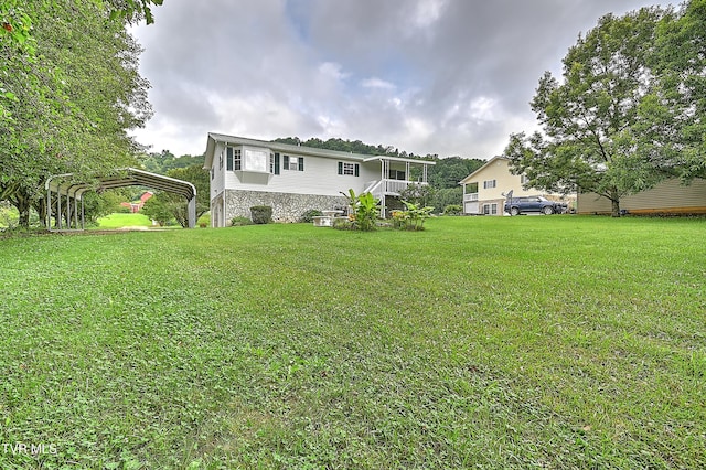 4970 Old Stage Rd, Chuckey, TN 37641 - back of property featuring a carport, a lawn, and stone siding