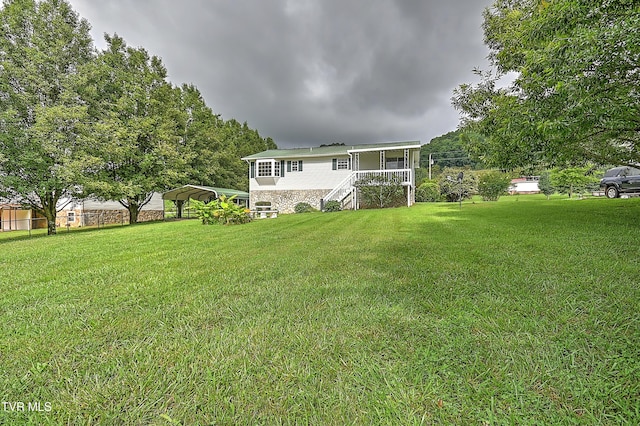 4970 Old Stage Rd, Chuckey, TN 37641 - rear view of property with stairway, a detached carport, stone siding, and a yard